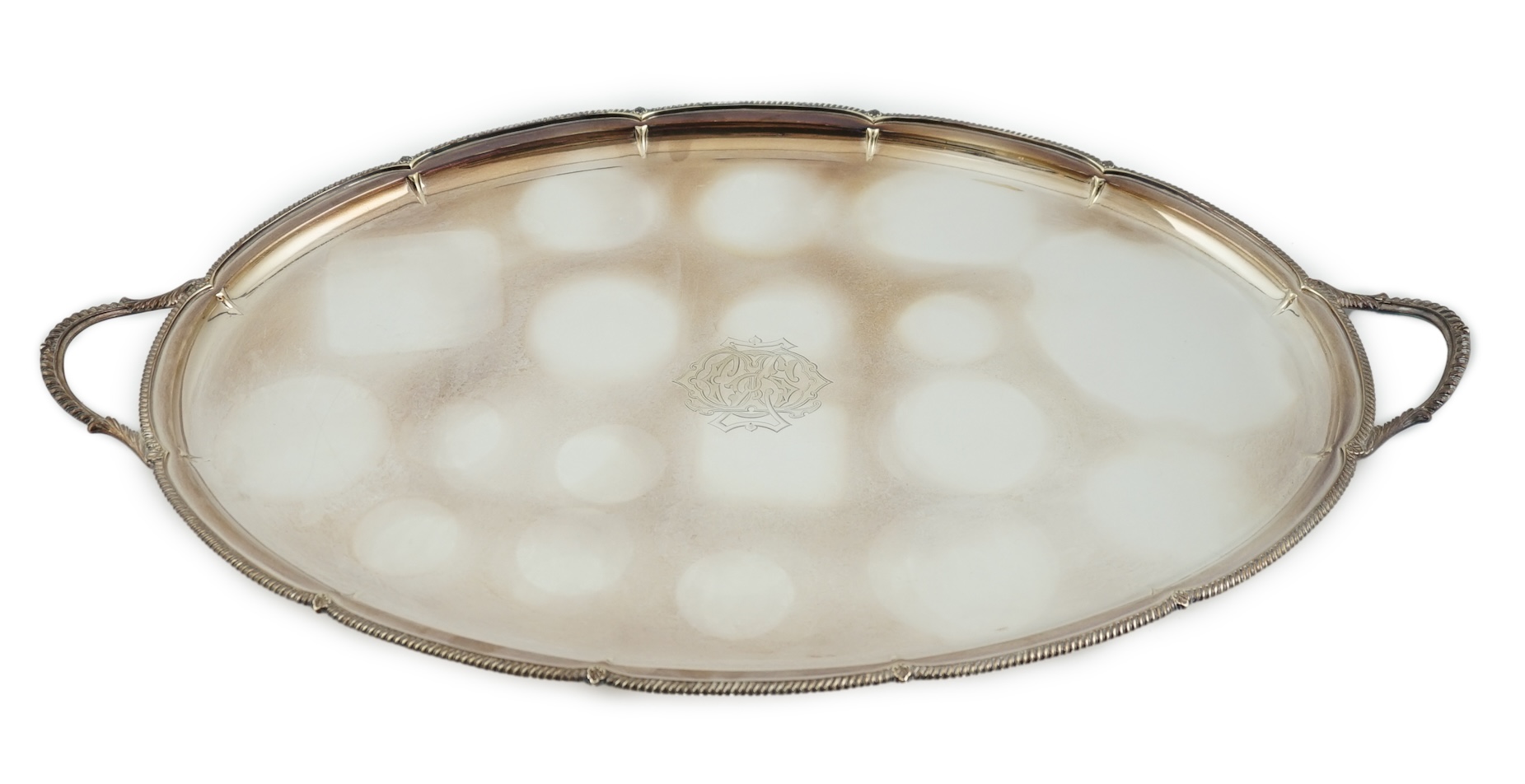 An Edwardian silver oval two handled tea tray, by George Howson